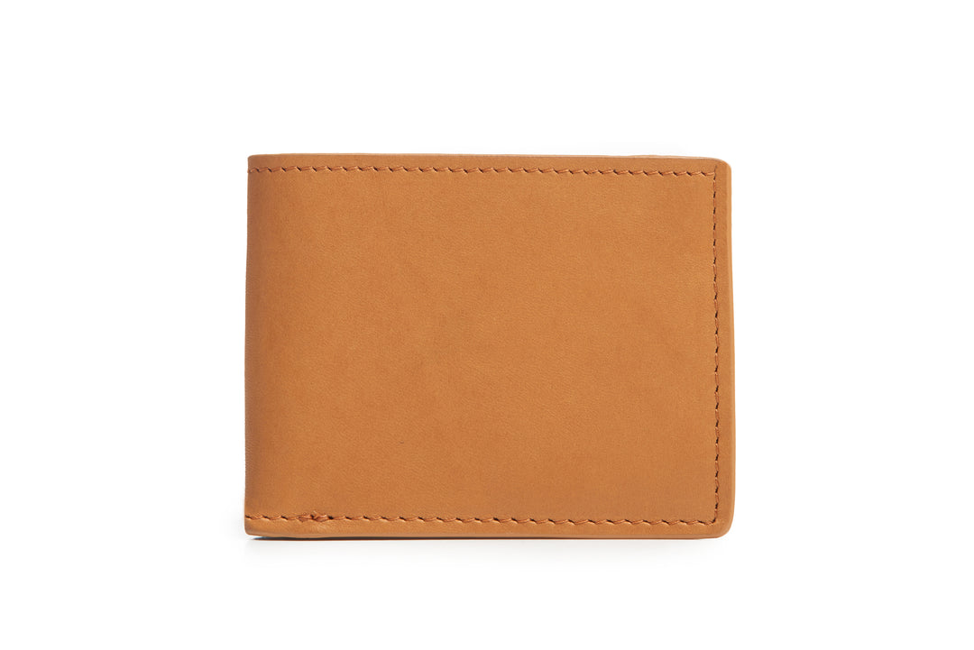 Tan Slim leather wallet The York leather billfold is handcrafted with American full-grain leather and offers a slim minimalist profile. With six scalloped credit card pockets and a vertical stash pocket, the York is perfect for traveling light while keeping your cards and cash secure. #color_tan