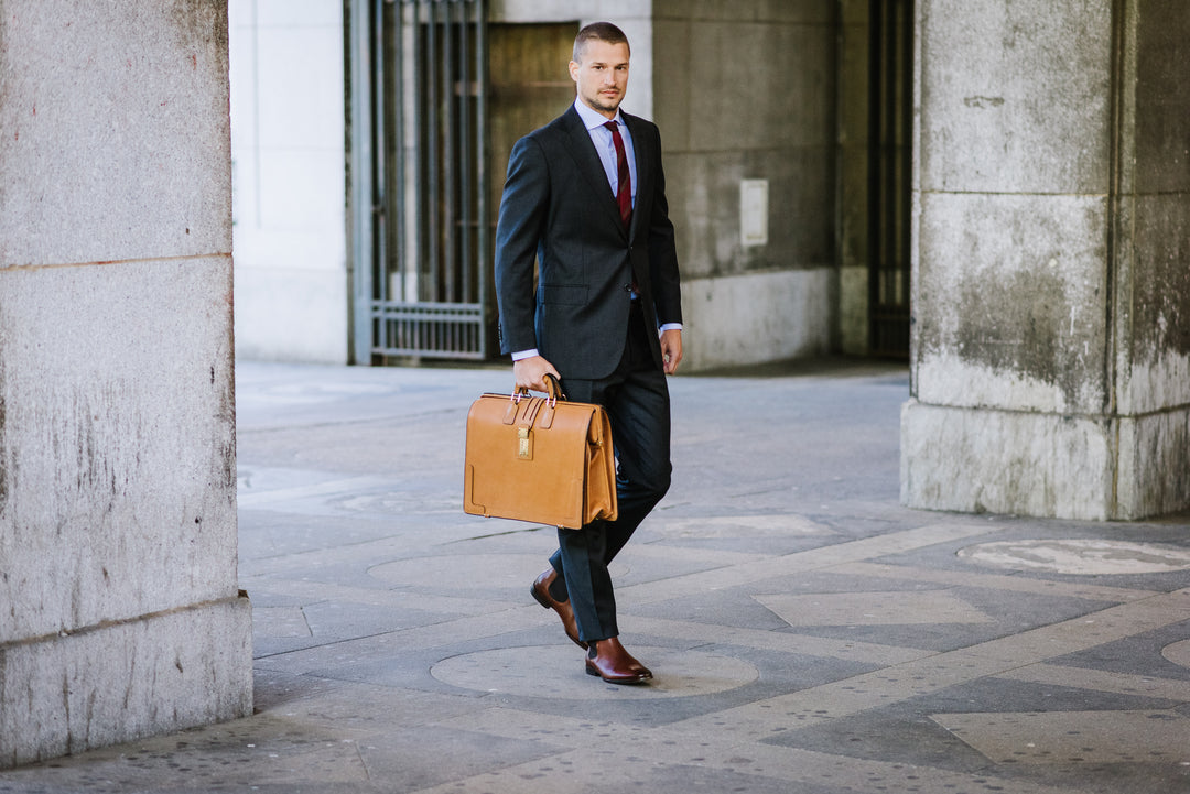 The Churchill is a classic, handcrafted full grain leather briefcase that features a handsome silhouette, and our patented Hinge-Loc technology, which allows the top frame to stay open with ease. #color_tan