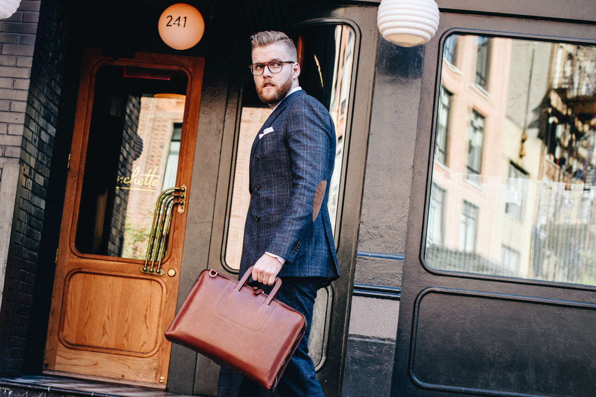 The Jackson is handcrafted with a beautiful full grain mill dyed American leather in a timeless Korchmar design. It includes a removable padded laptop sleeve. Historically not an item designed for shoulder carry, the new, improved design includes a full length adjustable shoulder strap #color_brown