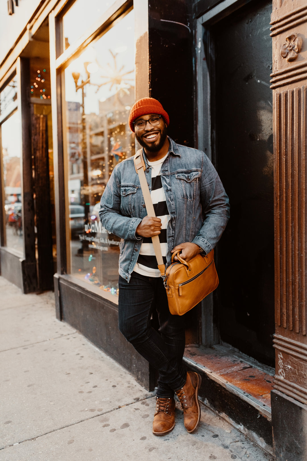 The Dylan leather briefcase features a removable, adjustable shoulder strap and built-in computer sleeve. It is designed with a secure top zipper, and can safely accommodate most 15" laptops #color_tan