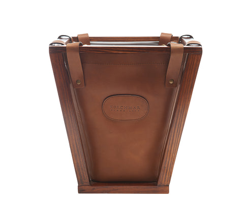 Espresso Leather wastebasket Here's a wastebasket you won't want to hide in the corner or under a desk. The Winslow leather wastebasket features full-grain American leather that is suspended securely on a beautiful pine wood frame. The Winslow leather wastebasket has a 4-gallon capacity and is the perfect size for your home office, bedroom or bathroom